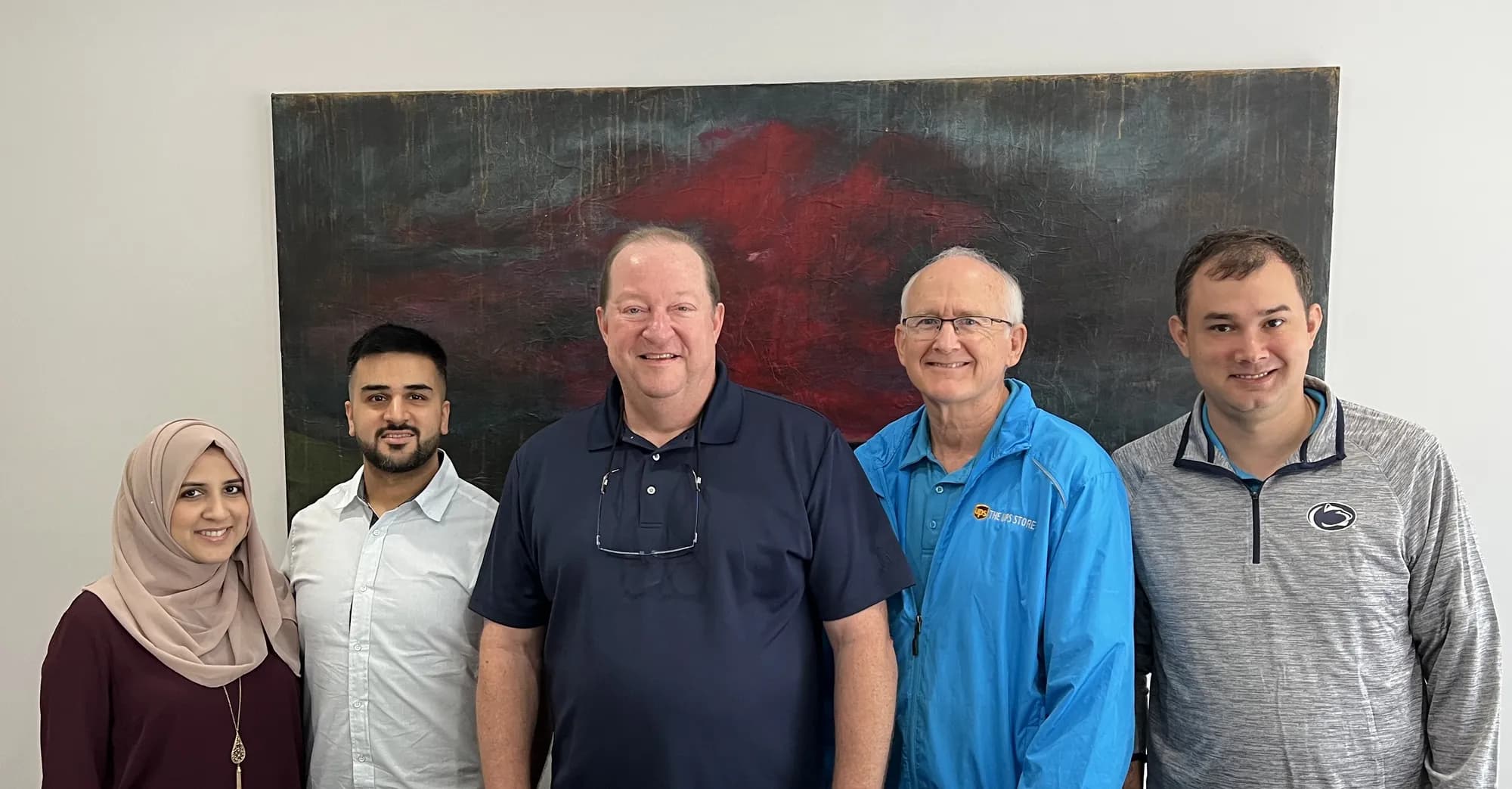Jim McElroy with buyers, sellers, and advisors at a business closing