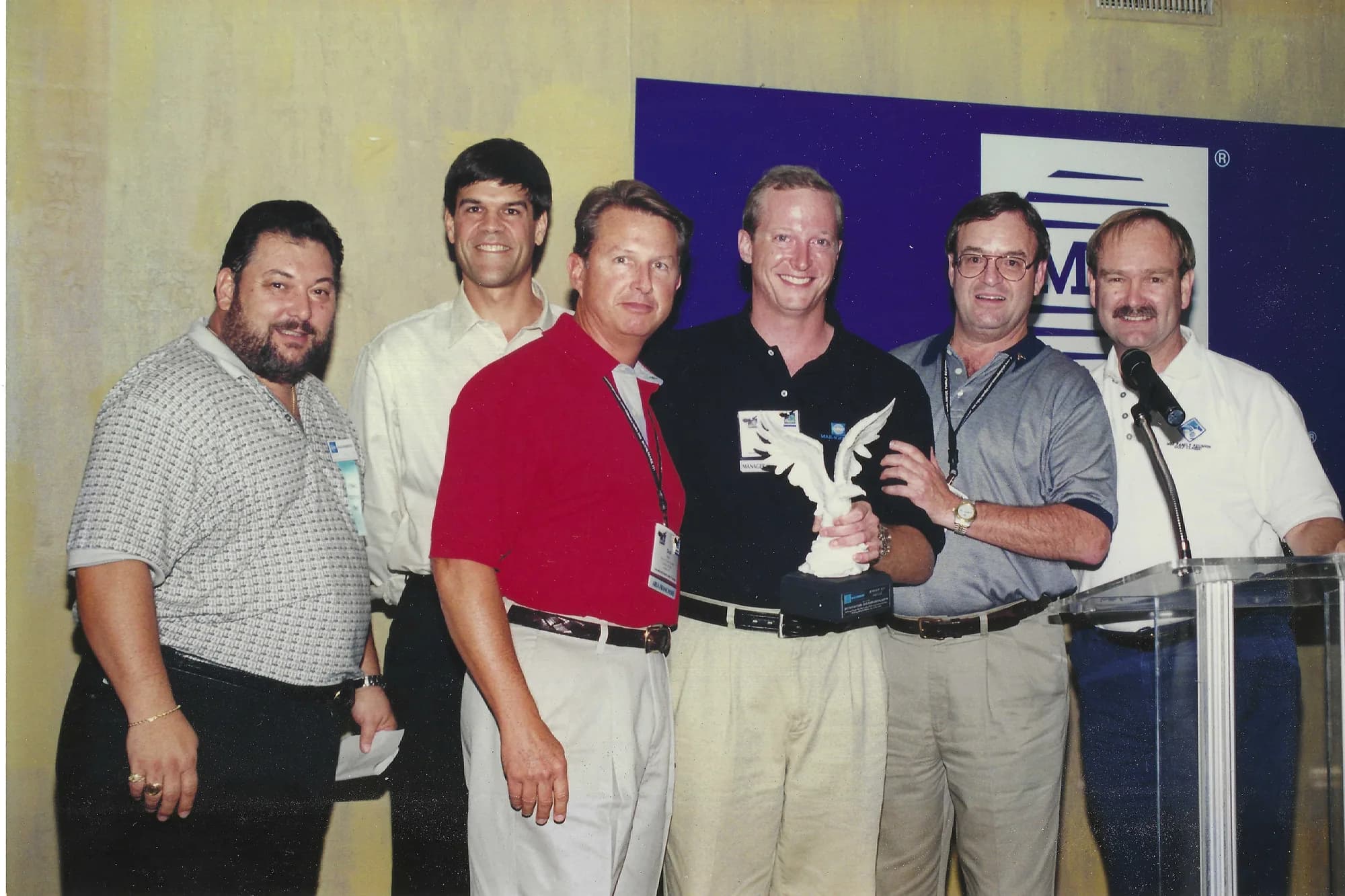 Jim McElroy and colleagues at a franchise development awards event